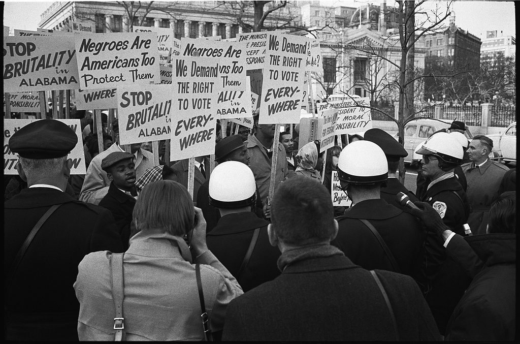 Demonstrators outside the White House hold signs demanding the right to vote and protesting police brutality against civil rights demonstrators in Alabama in March 1965. Credit: Library of Congress